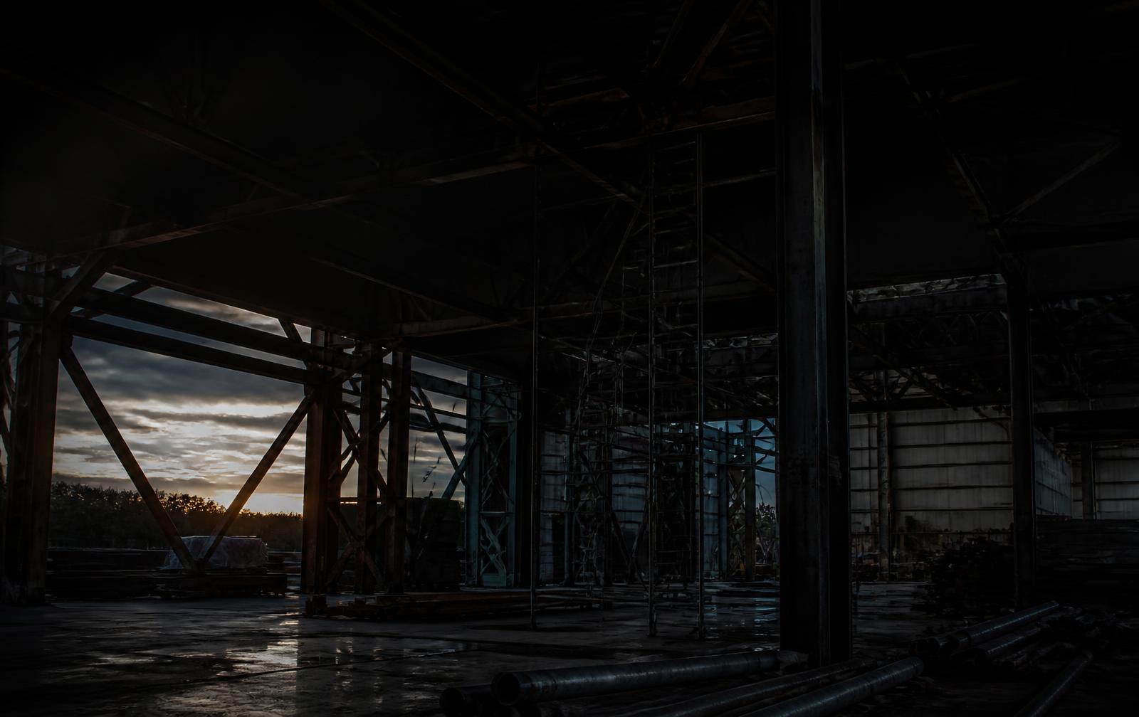 Steel frame of an industrial building at dusk